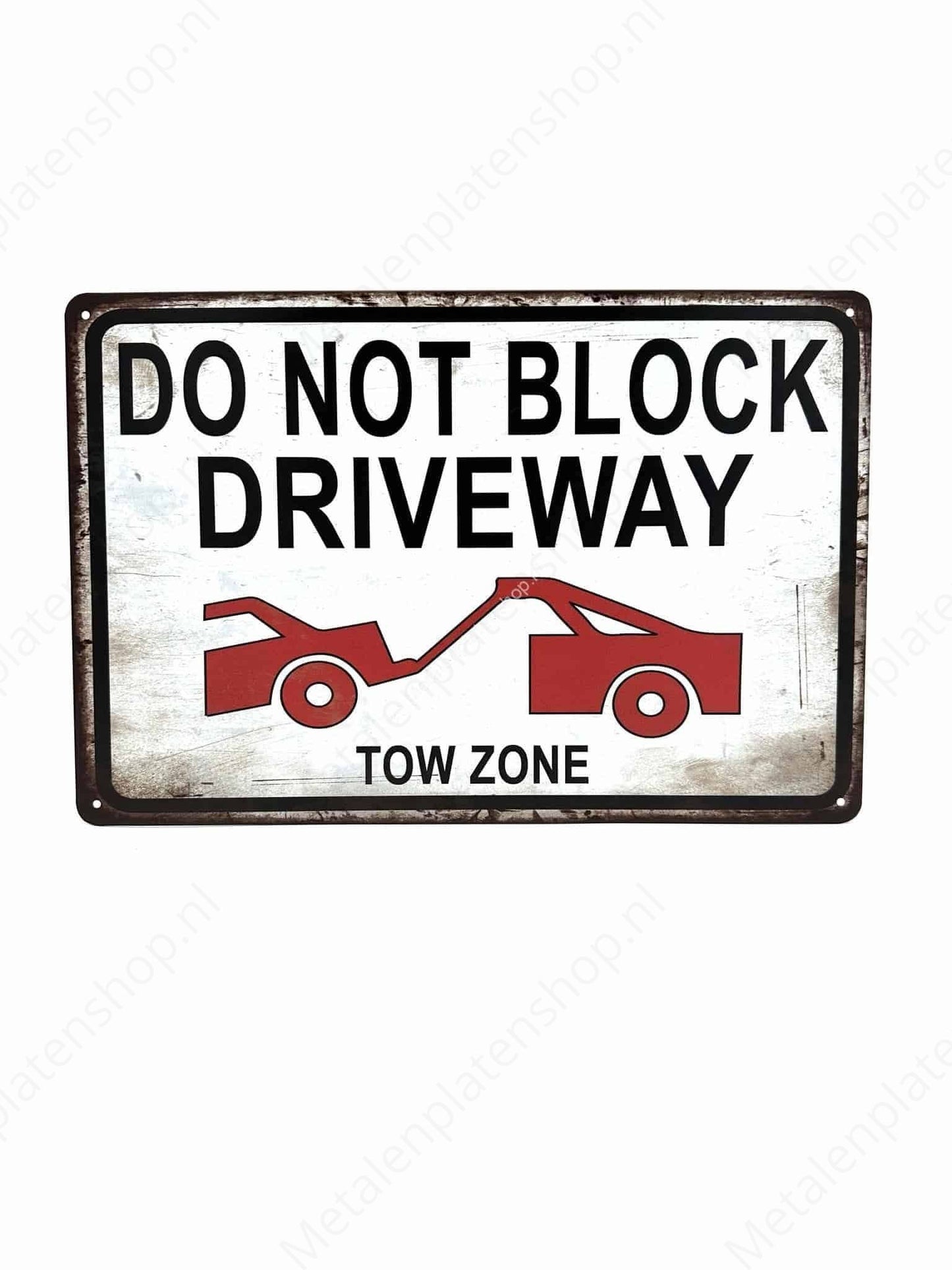 Do not block driveway - Tow zone